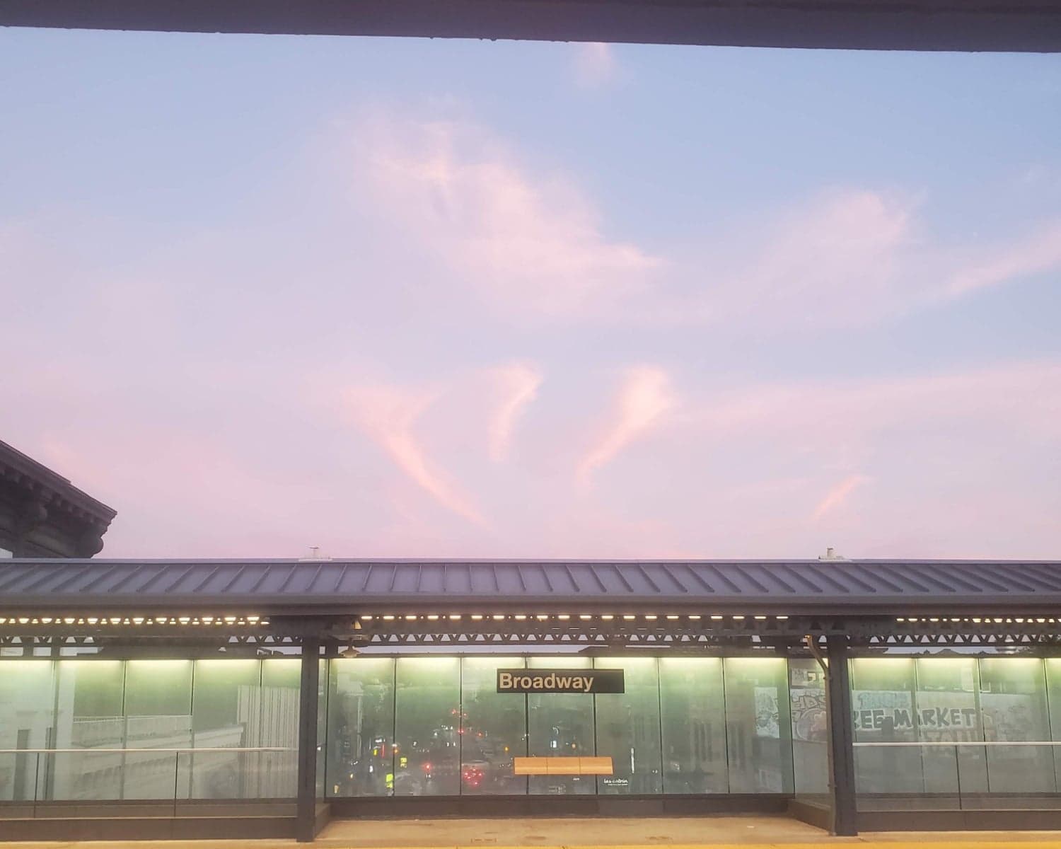 Sunset over the Broadway subway station platform in Astoria